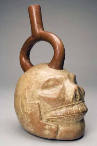 Stirrup-spout vessel in the form of a skull
