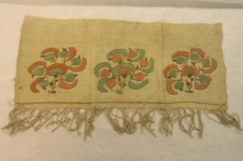 Crewel needlework sampler with three floral sprays