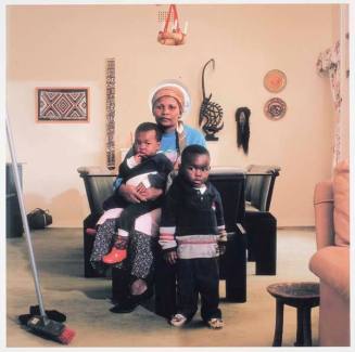 Victoria Cobokana, housekeeper, in her employer's dining room with her son Sifiso and daughter Onica, Johannesburg, June 1999. Victoria died of AIDS 13 December 1999, Sifiso died of AIDS 12 January 2000, Onica died of AIDS in May 2000