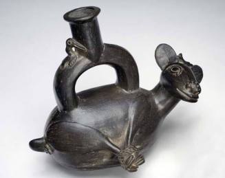 Stirrup-spout vessel in the form of a bound deer