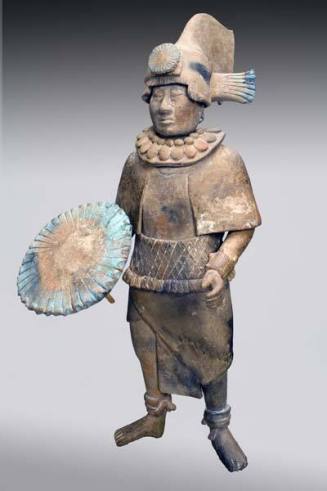 Standing figure with shield or parasol