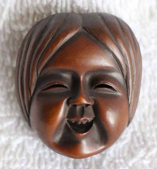 Netsuke of Okame