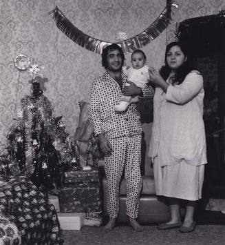 Mother, father and child in front of Christmas tree, from the series "Lower West Side"