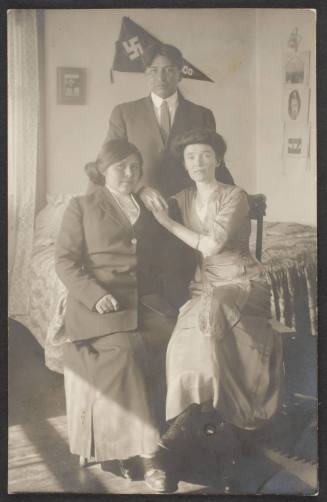 Two Unidentified Women and Man