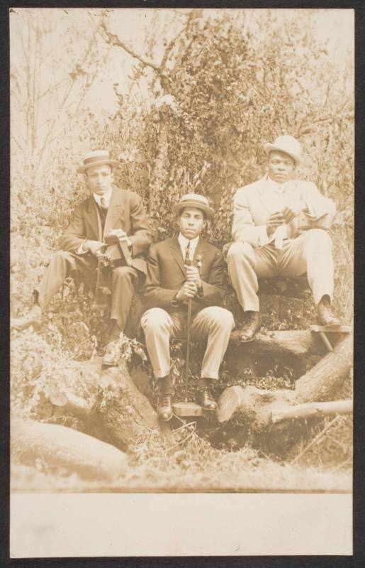 Portrait of Three Men with Camera Equipment