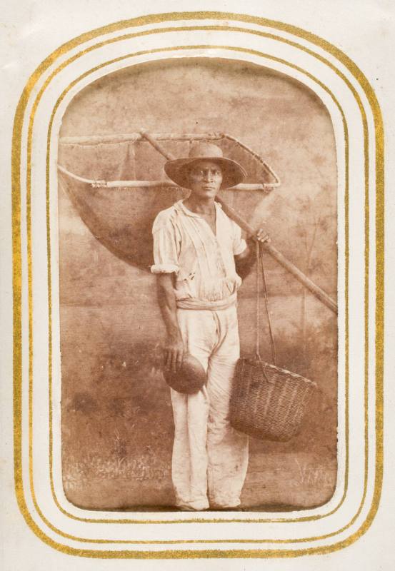 Pescador [fisherman in white clothing holding large canvas net and basket], from the album "Mexican Occupationals"