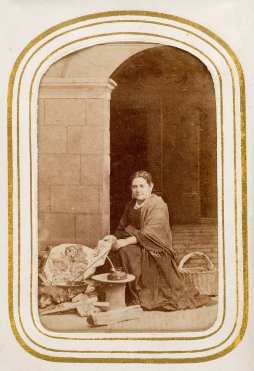 Buñolera [seated woman wearing rebozo selling buñuelos], from the album "Mexican Occupationals"