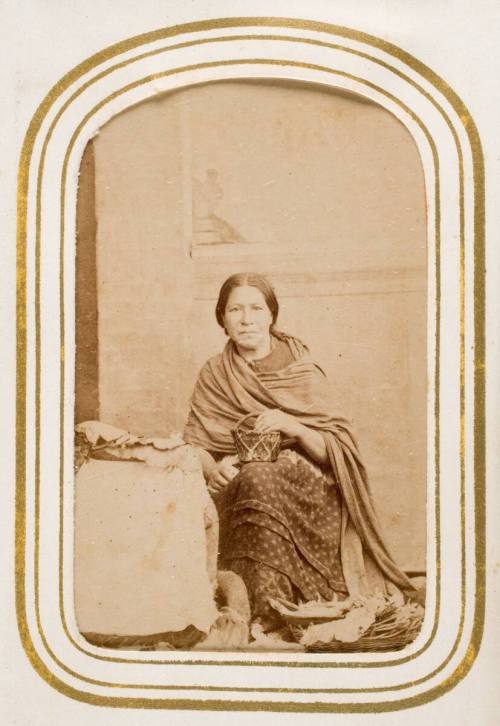 Tamalera [seated woman with rebozo selling tamales], from the album "Mexican Occupationals"