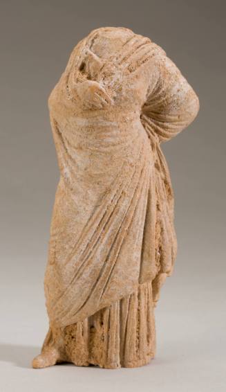 Tanagra figurine of a standing draped woman