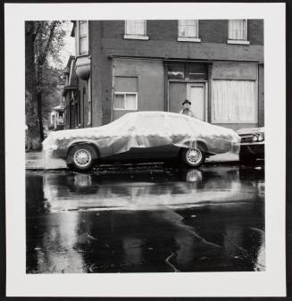 Car with carnations and plastic sheet, from the series "Lower West Side"