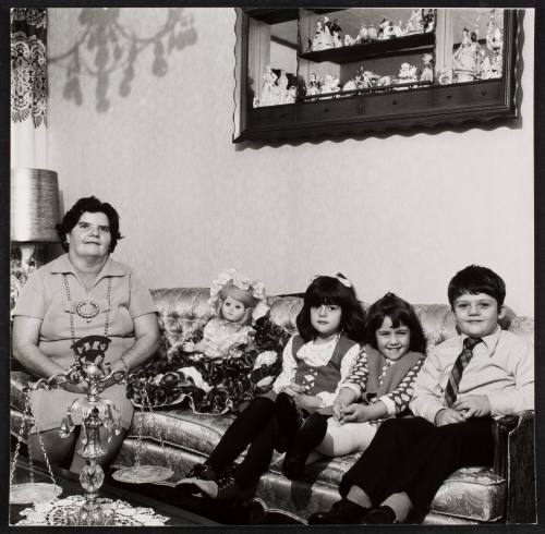 Woman, doll, and three children on couch, from the series "Lower West Side"