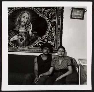Couple under Jesus tapestry, from the series "Lower West Side"