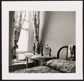 Bed and Christian figurines, from the series "Lower West Side"