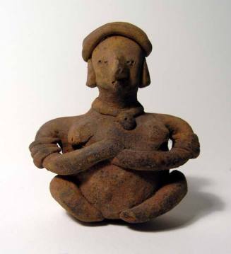 Seated female figurine