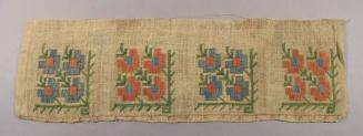 Crewel needlework sampler with four floral patterns