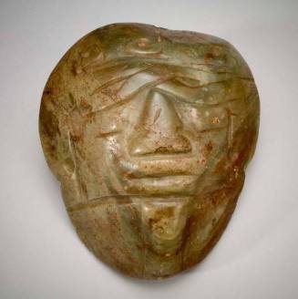 Greenstone mask mounted on plaque